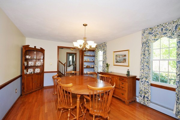 38 Spaulding Road Chelmsford, MA 01824 - Photo 4 of 14 a dining room with furniture a chandelier and wooden floor