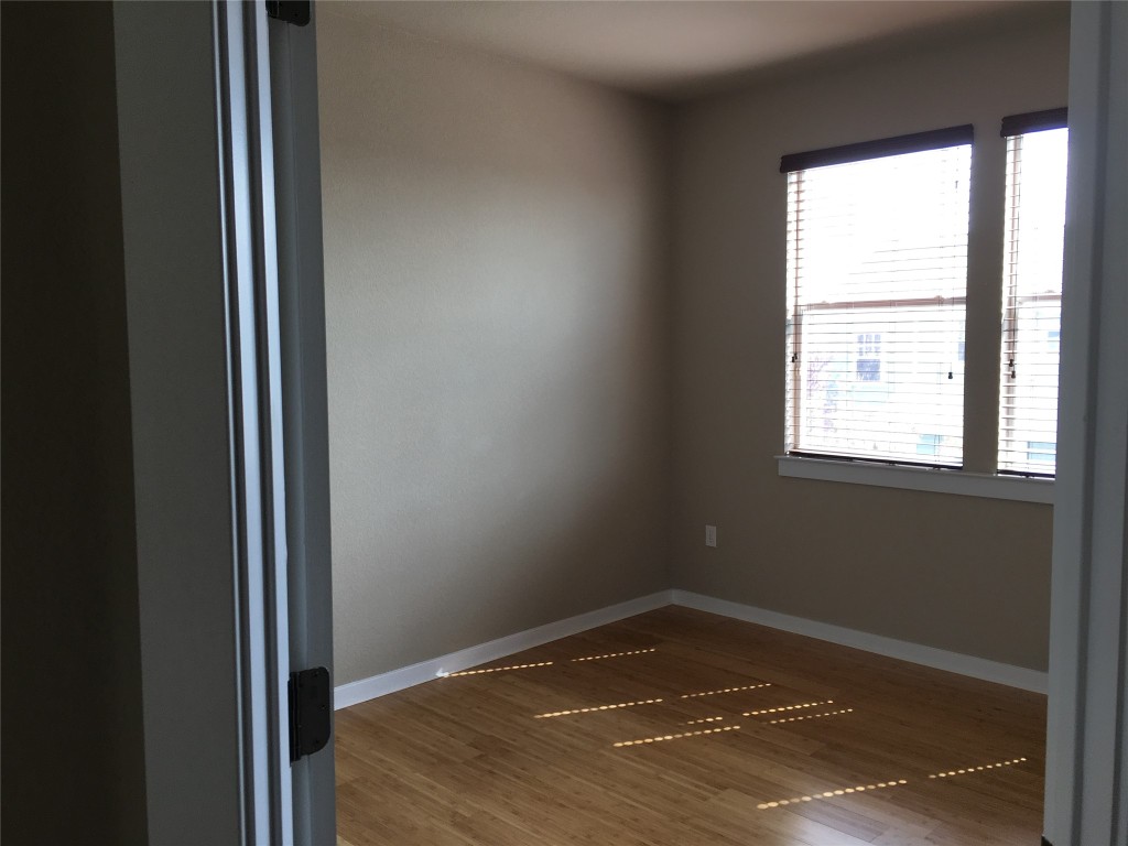 1924 Littlefield Street Austin, TX 78723 - Photo 14 of 19 a view of empty room with wooden floor