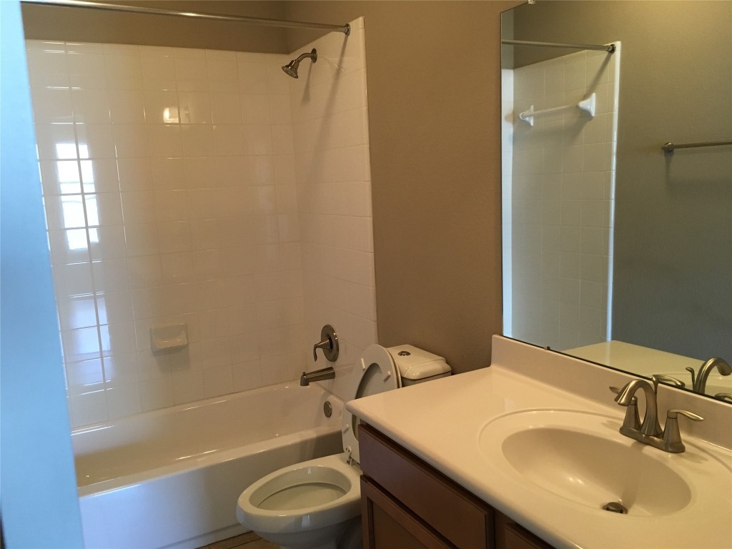 1924 Littlefield Street Austin, TX 78723 - Photo 17 of 19 a bathroom with a sink toilet and shower