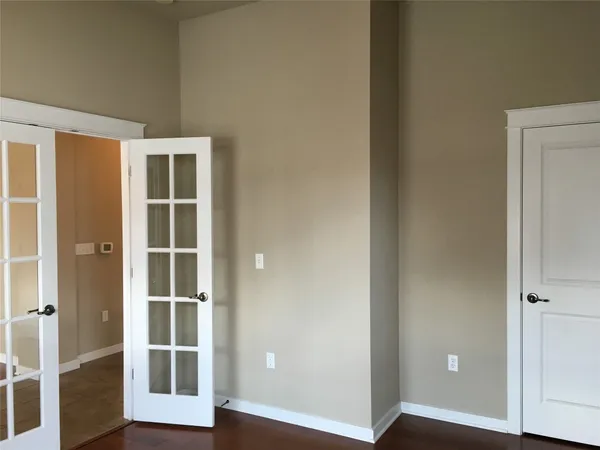 a view of front door with wooden floor