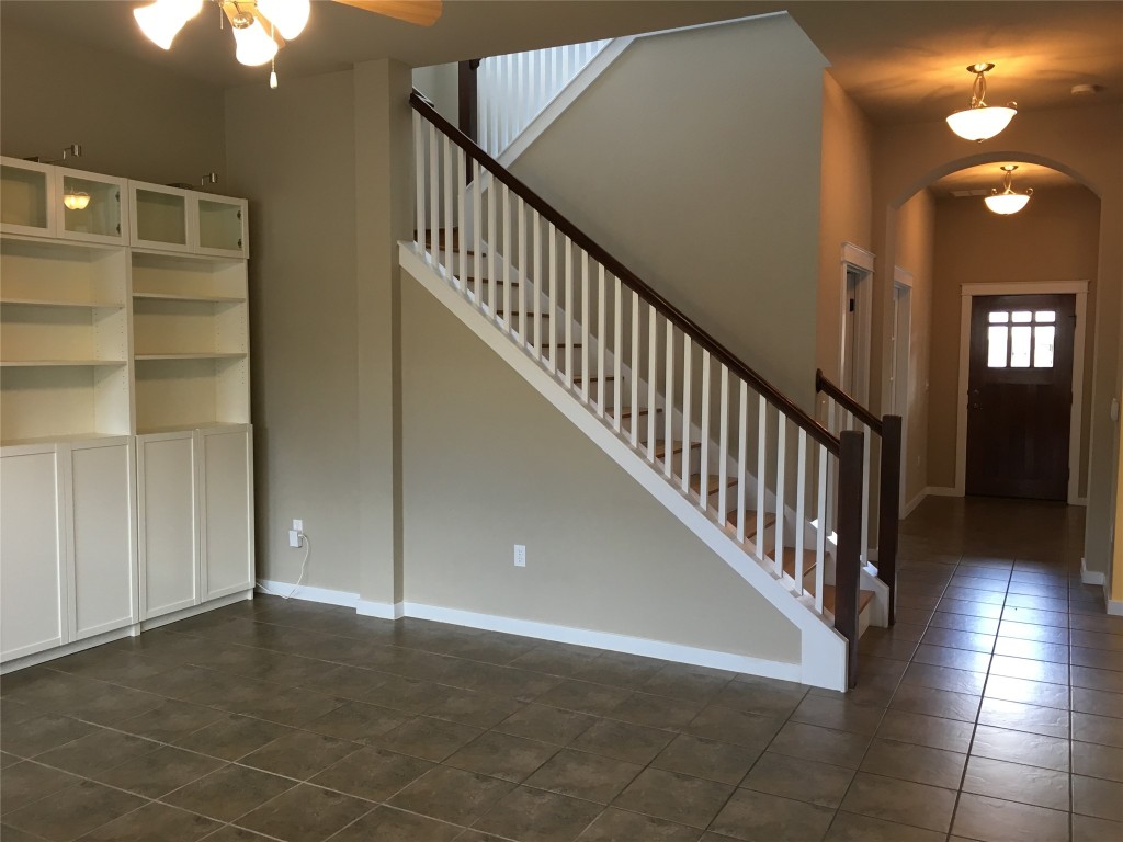 1924 Littlefield Street Austin, TX 78723 - Photo 4 of 19 a view of staircase with lots of frames on wall and a window