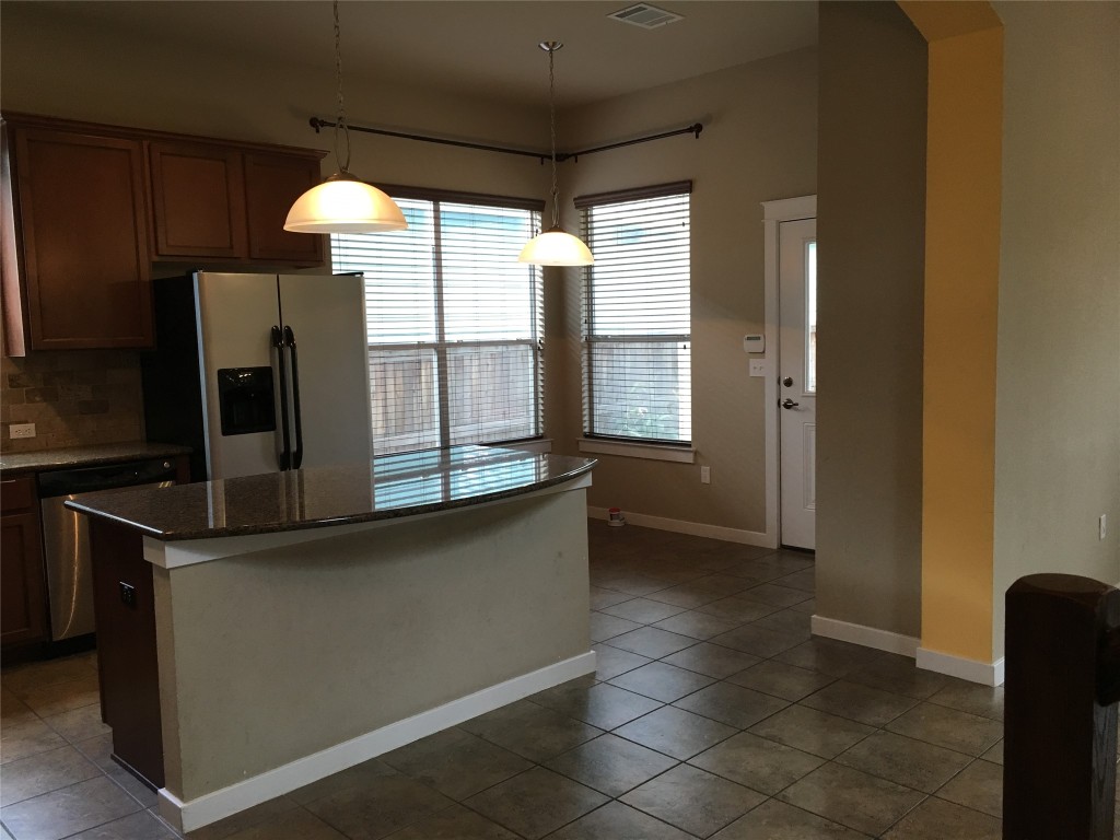 1924 Littlefield Street Austin, TX 78723 - Photo 6 of 19 a kitchen with stainless steel appliances a sink and a window