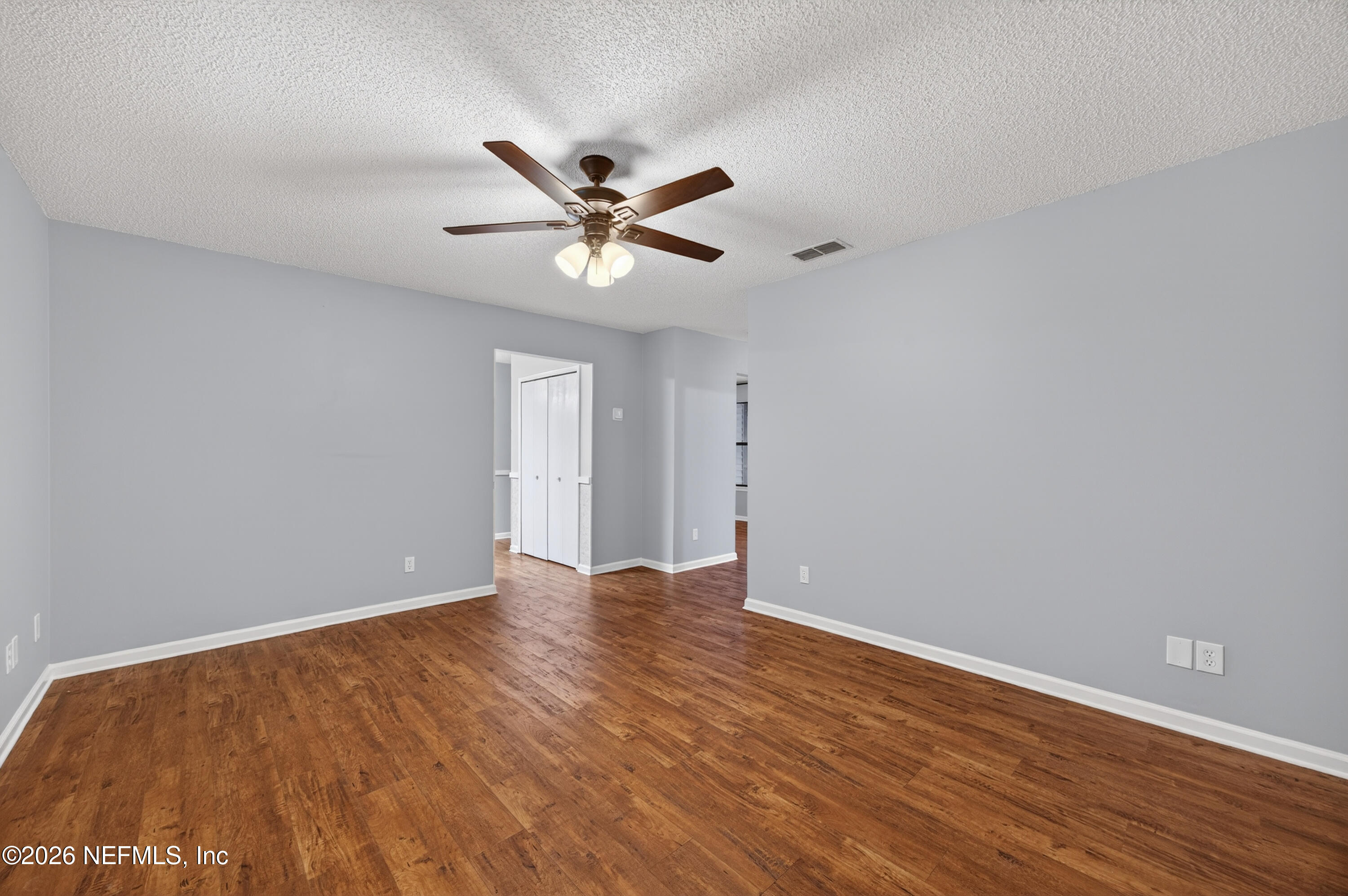 4537 Junction Drive Middleburg, FL 32068 - Photo 13 of 62 a view of an empty room with wooden floor