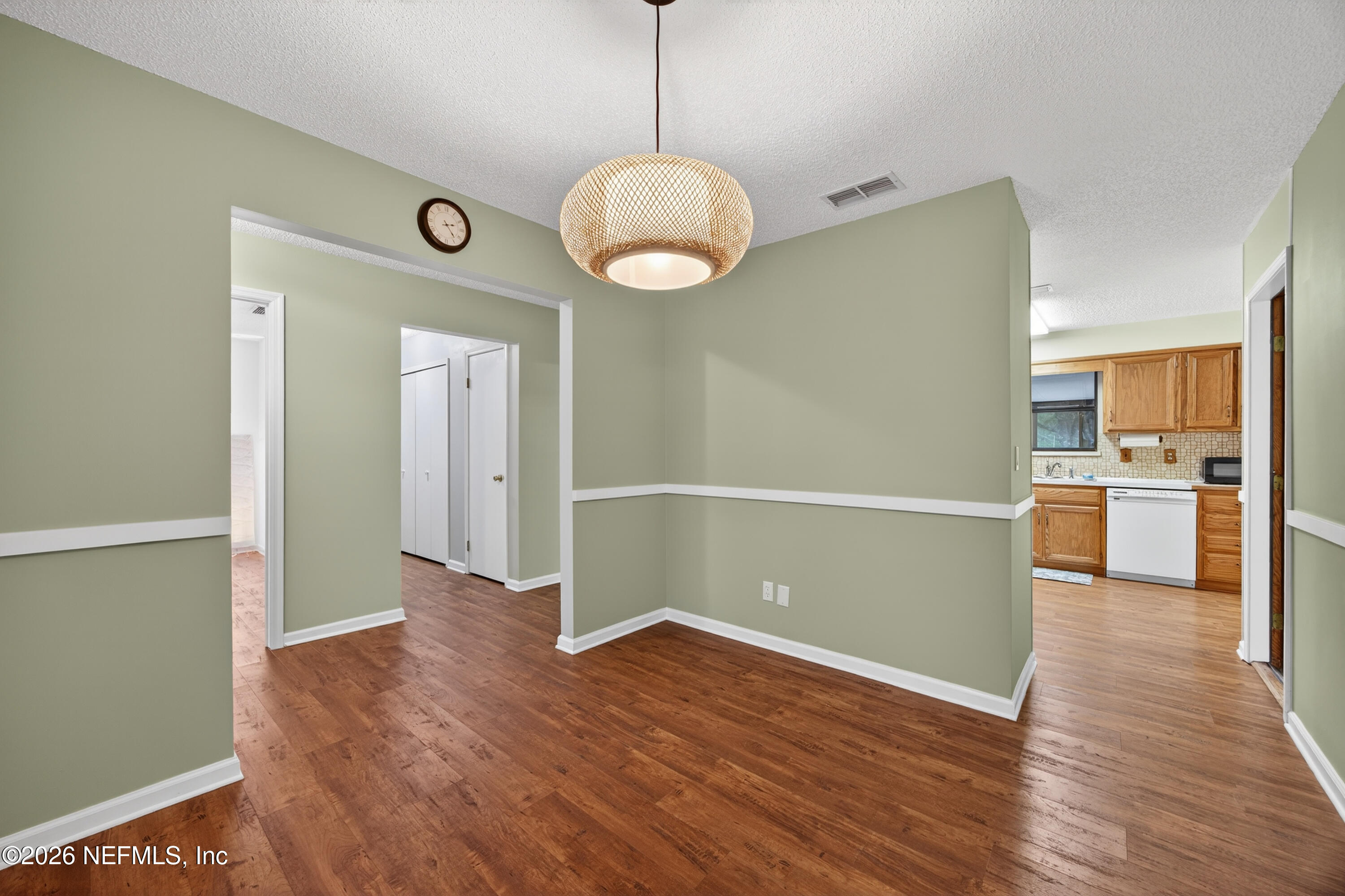 4537 Junction Drive Middleburg, FL 32068 - Photo 16 of 62 a view of a kitchen with wooden floor and a large window