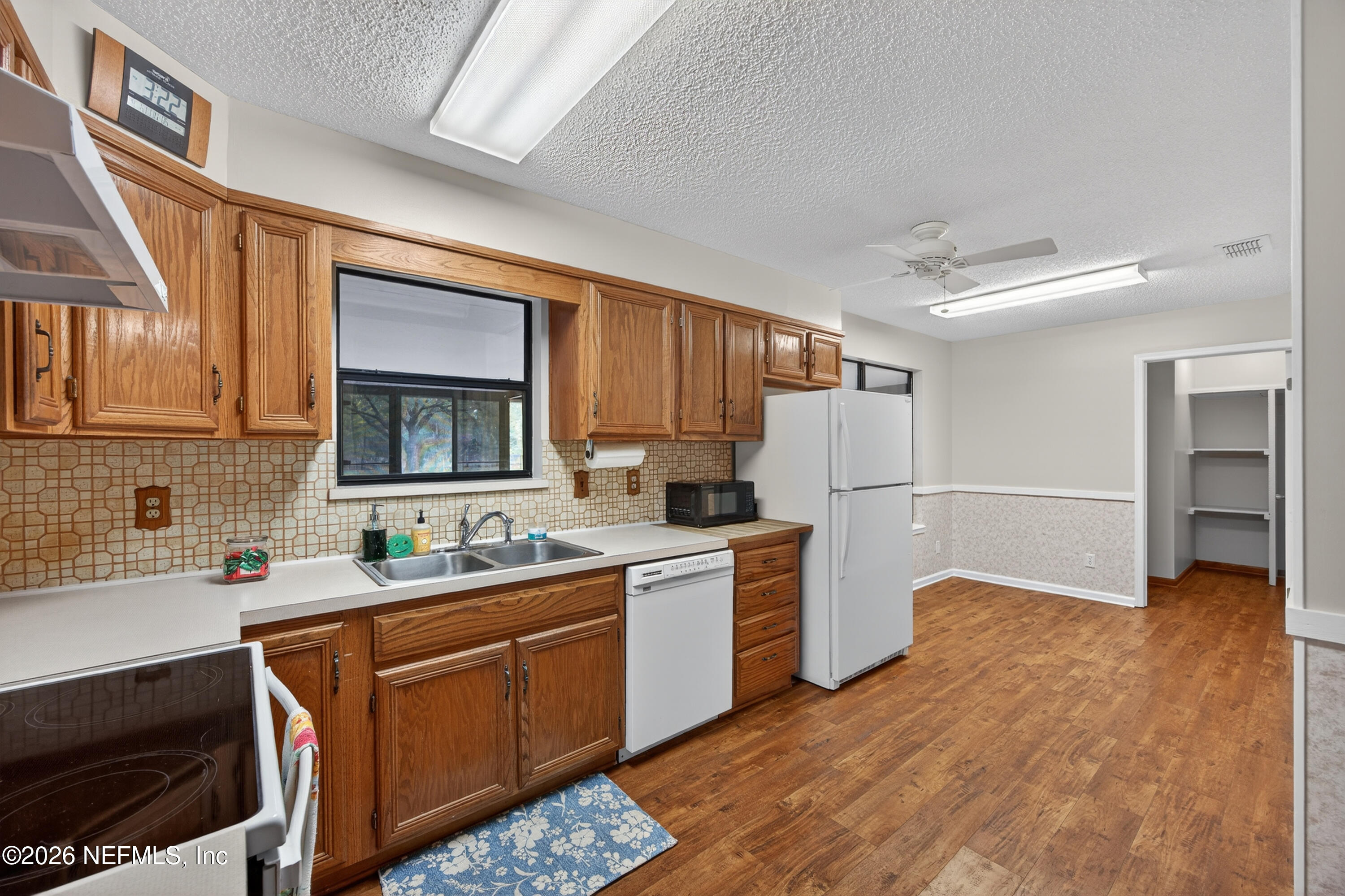4537 Junction Drive Middleburg, FL 32068 - Photo 22 of 62 a kitchen with a sink stove and cabinets
