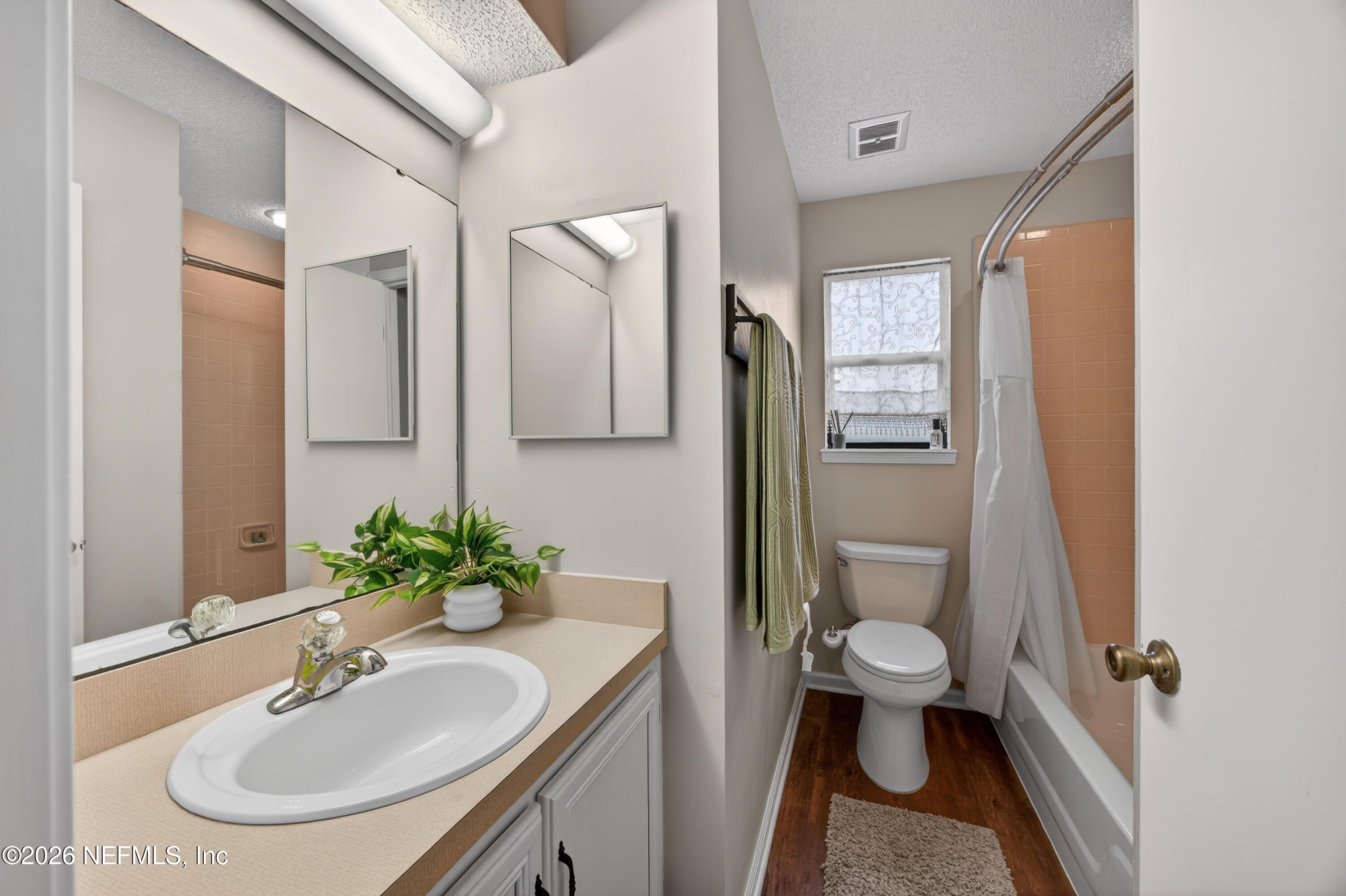 4537 Junction Drive Middleburg, FL 32068 - Photo 26 of 62 a bathroom with a sink toilet and shower