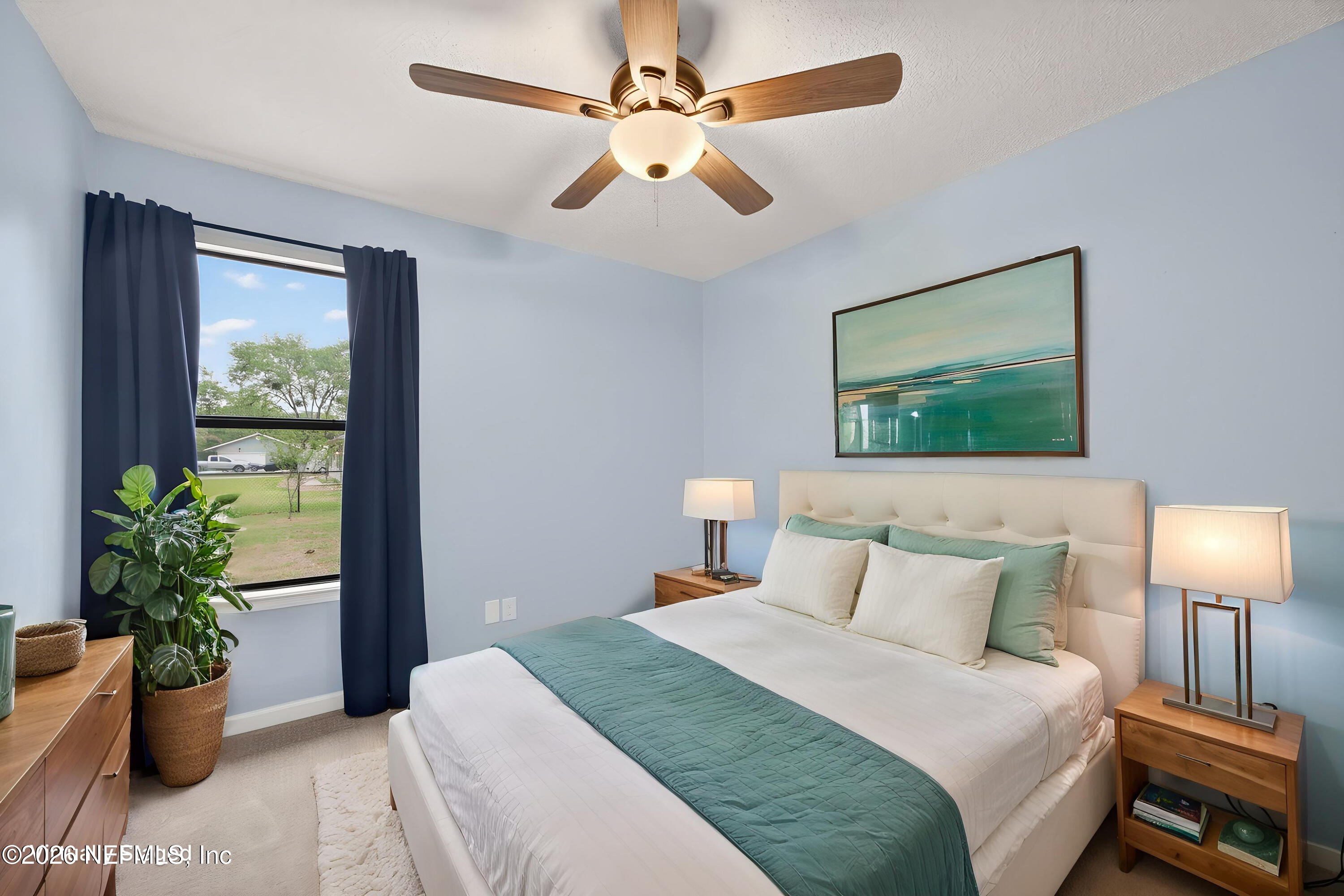 4537 Junction Drive Middleburg, FL 32068 - Photo 29 of 62 a bedroom with a balcony a bed and a chandelier