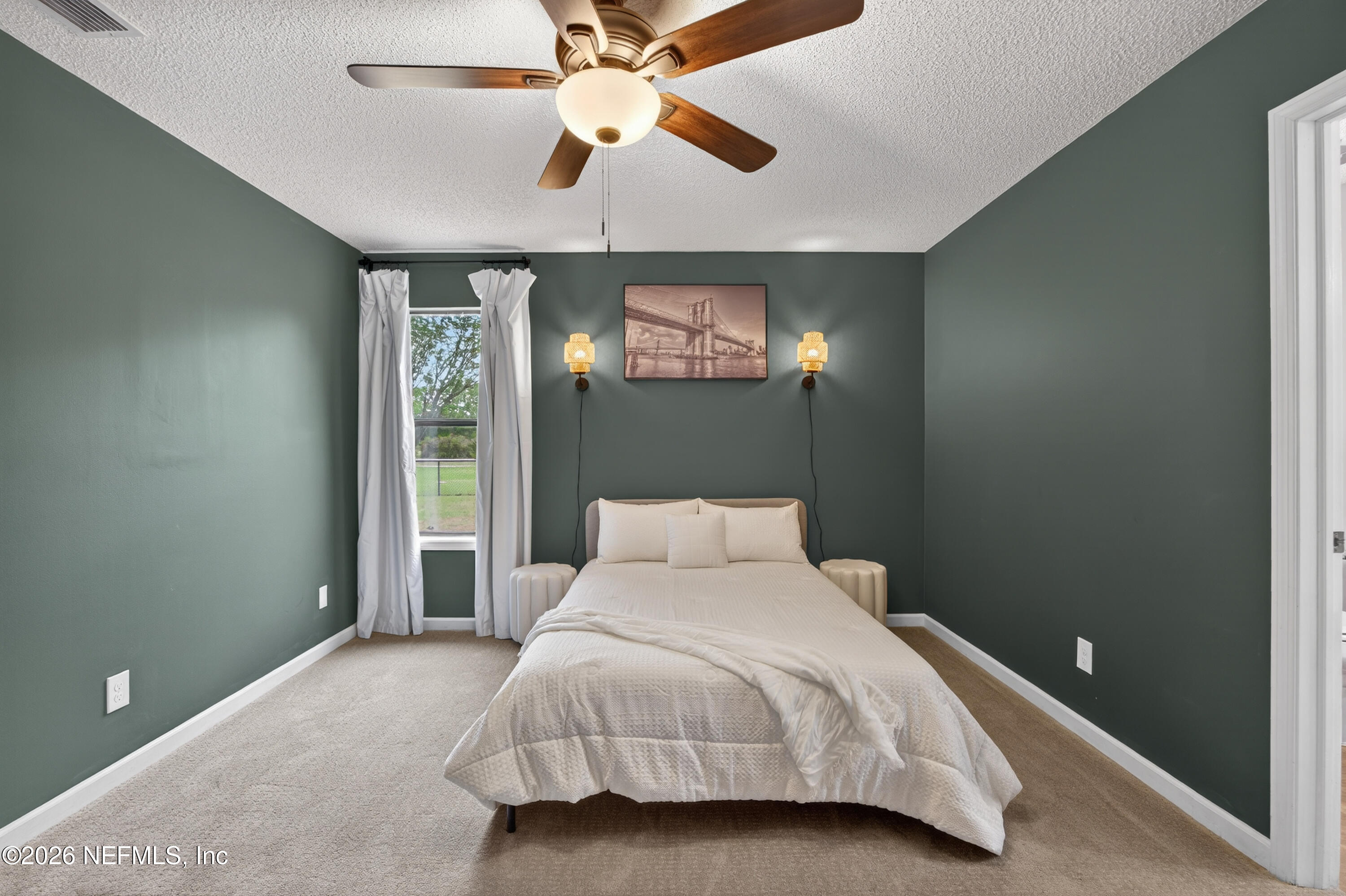 4537 Junction Drive Middleburg, FL 32068 - Photo 33 of 62 a bedroom with a bed and a window