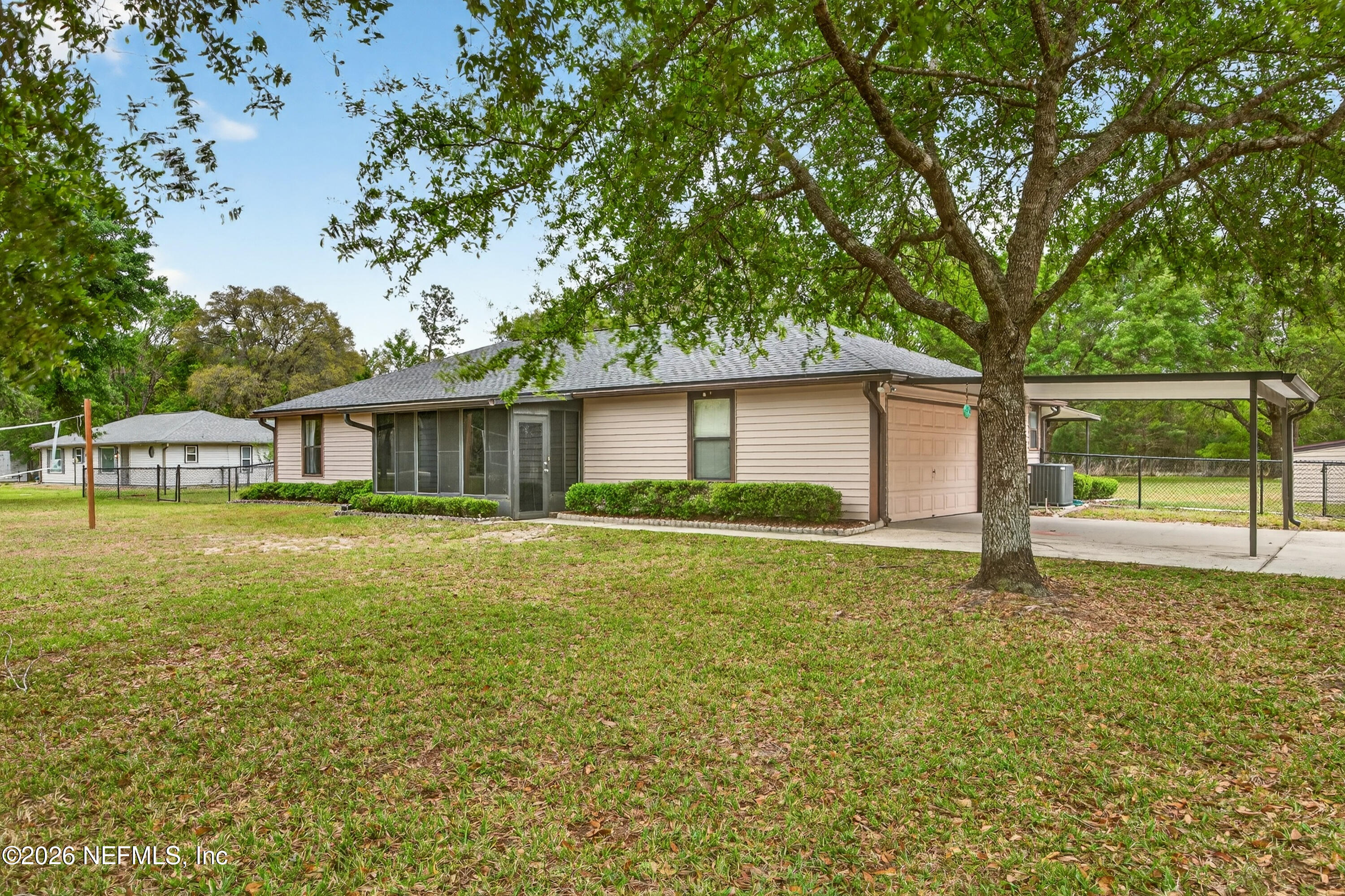 4537 Junction Drive Middleburg, FL 32068 - Photo 4 of 62 a front view of a house with a yard