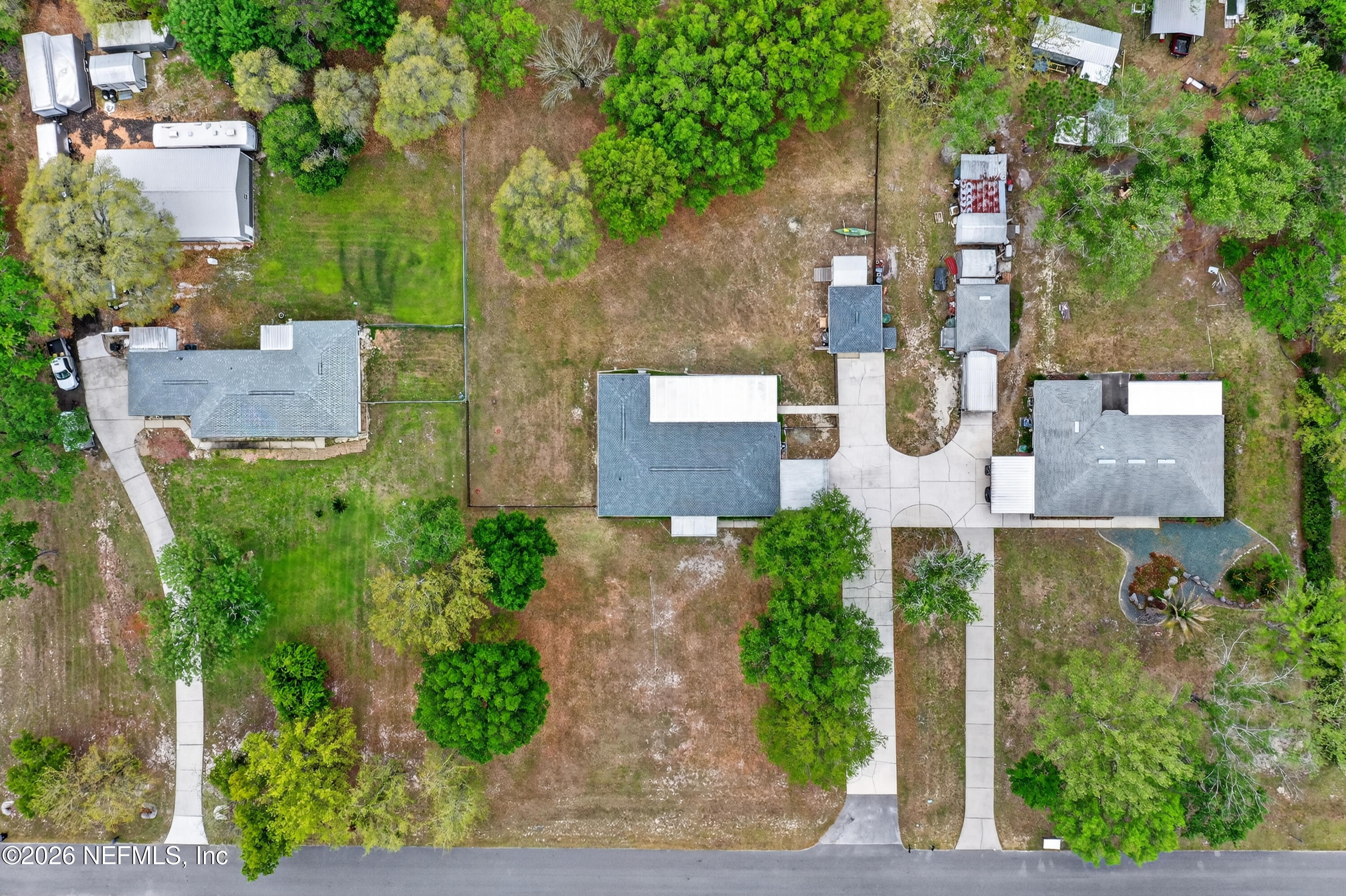 4537 Junction Drive Middleburg, FL 32068 - Photo 55 of 62 an aerial view of a house with garden space and a street view
