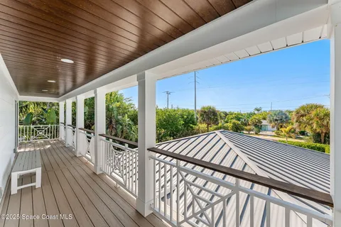 a bedroom with a bed and a chair