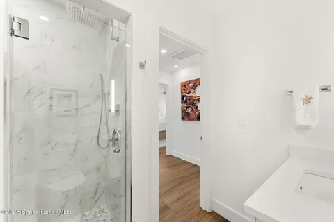 a view of a kitchen with a sink and furniture