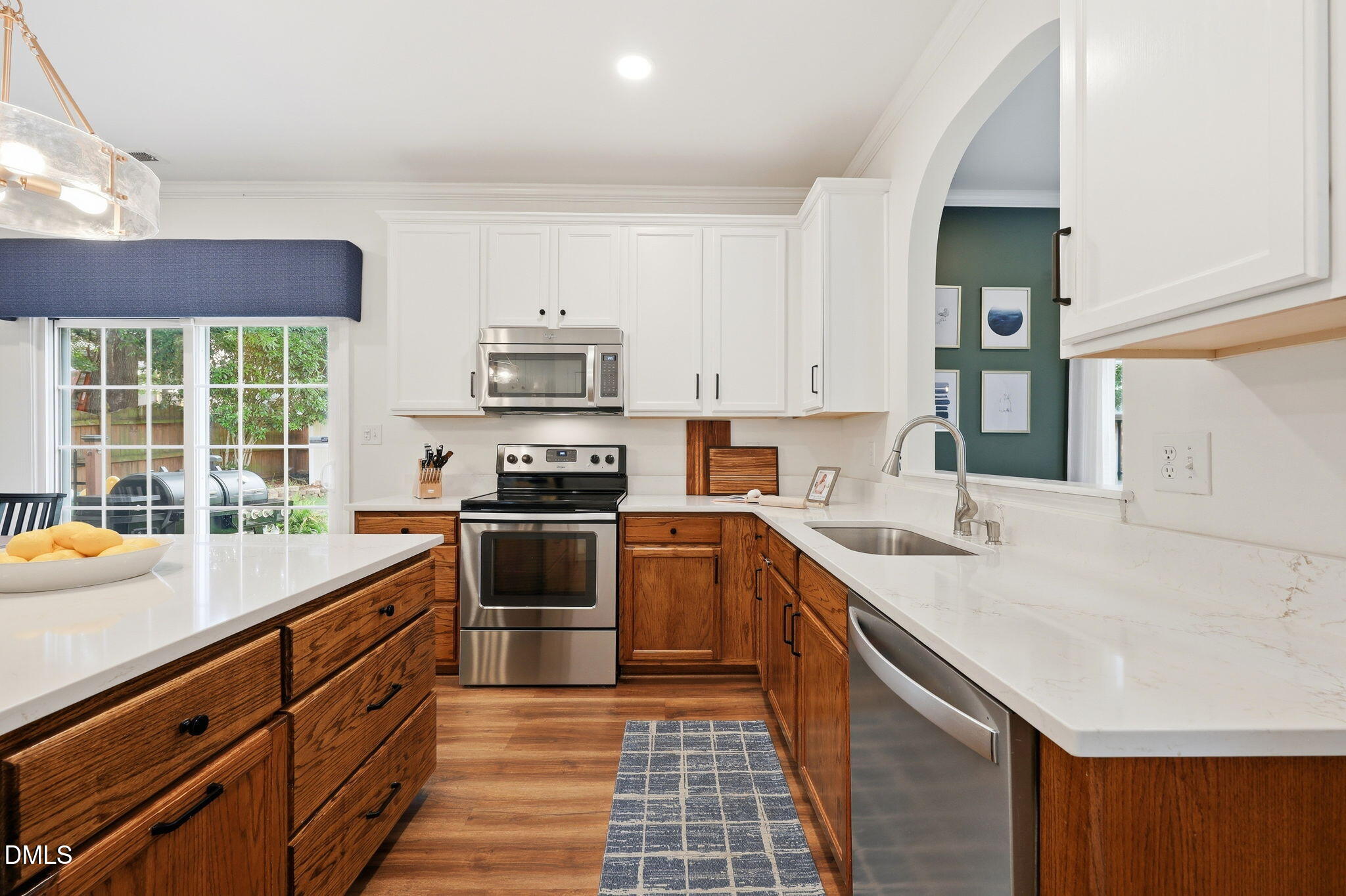5629 Enoree Lane Raleigh, NC 27616 - Photo 12 of 38 a kitchen with a sink stove and cabinets