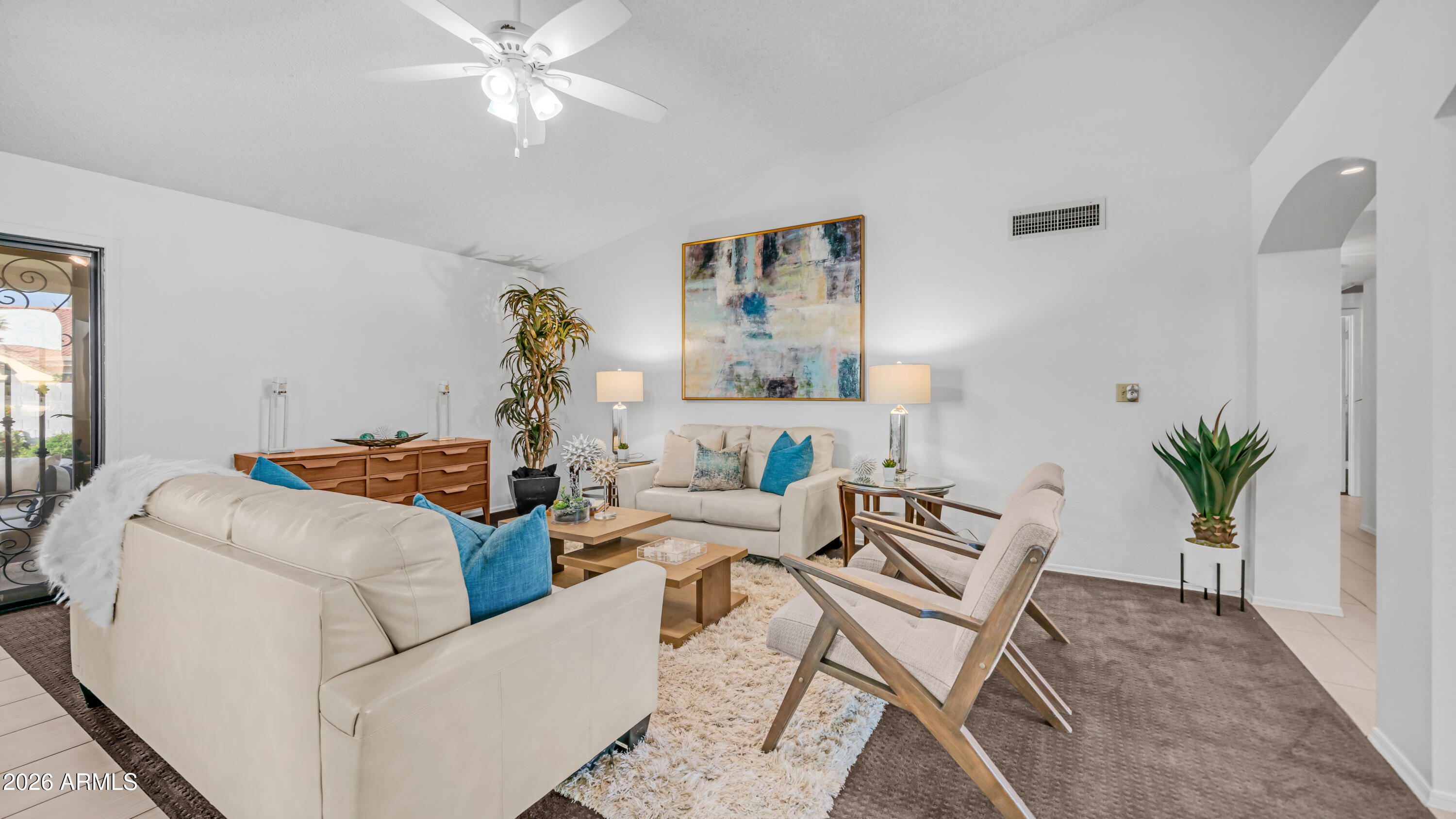 408 East Meadows Lane Gilbert, AZ 85234 - Photo 12 of 42 a living room with furniture and a chandelier