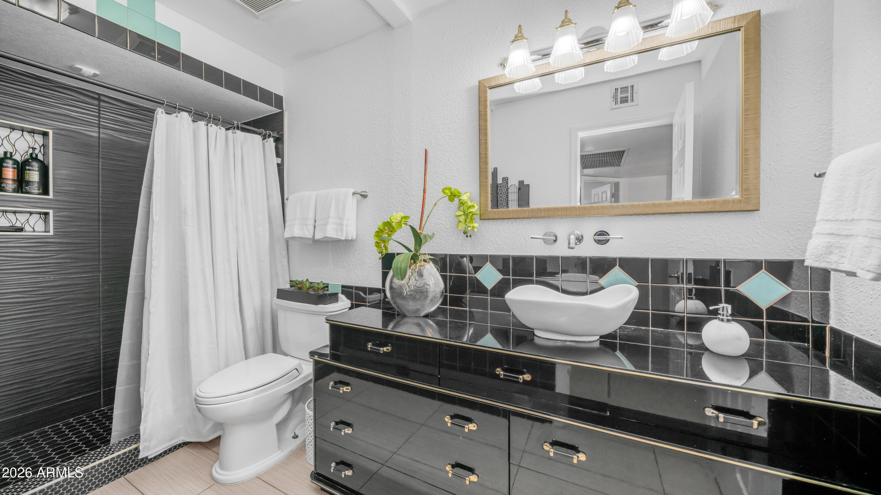408 East Meadows Lane Gilbert, AZ 85234 - Photo 21 of 42 a bathroom with a granite countertop sink a toilet and mirror