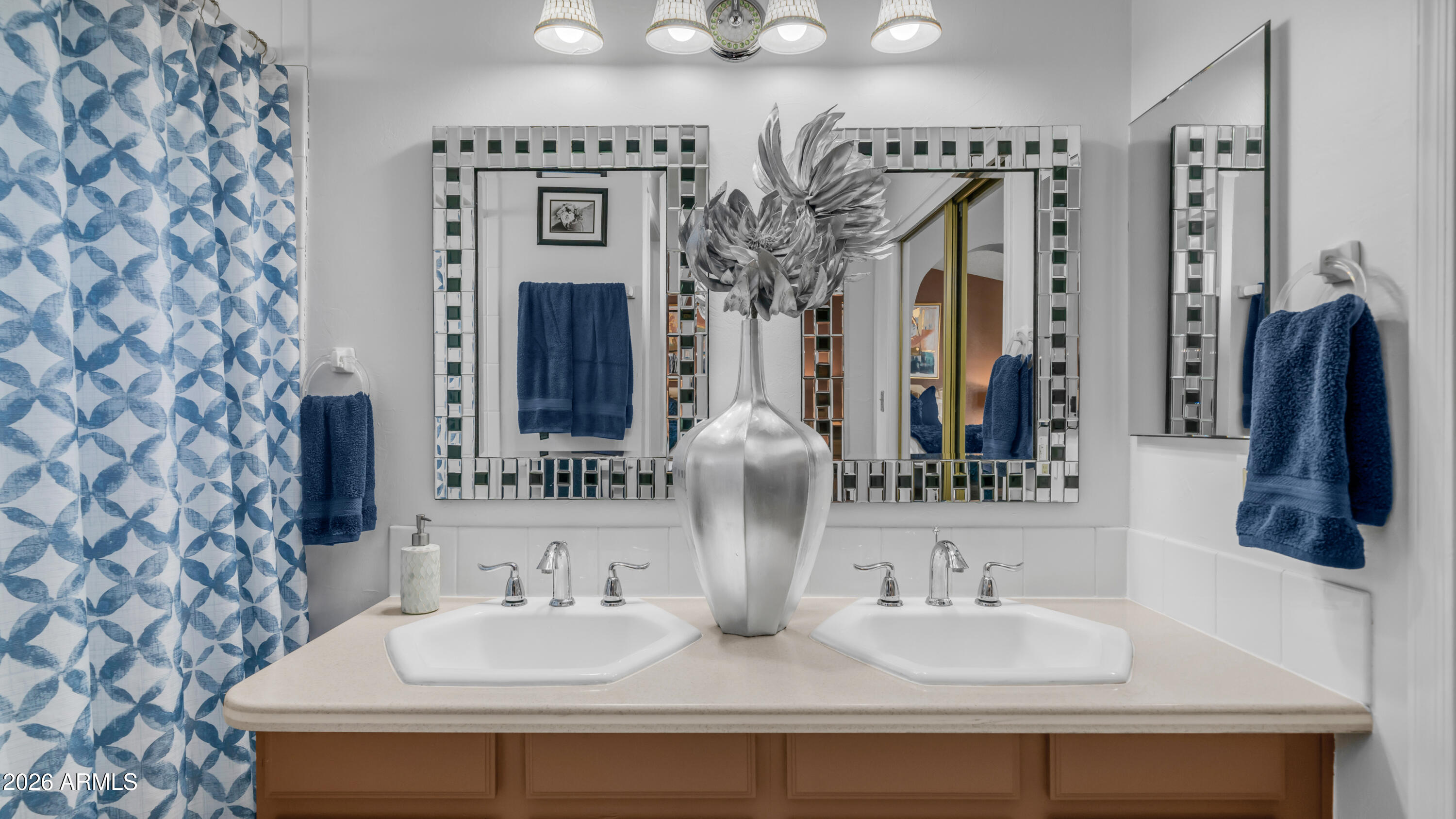 408 East Meadows Lane Gilbert, AZ 85234 - Photo 24 of 42 a bathroom with a sink and a mirror