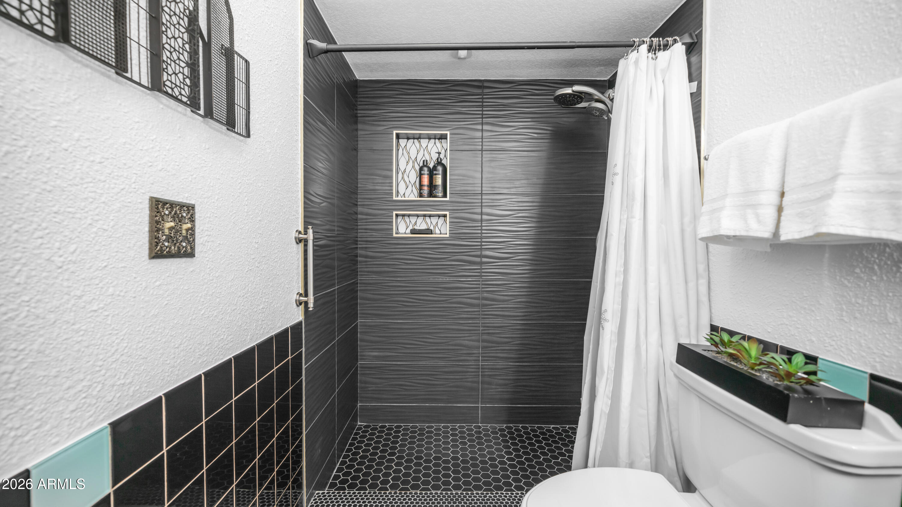 408 East Meadows Lane Gilbert, AZ 85234 - Photo 3 of 42 a bathroom with a toilet and a shower