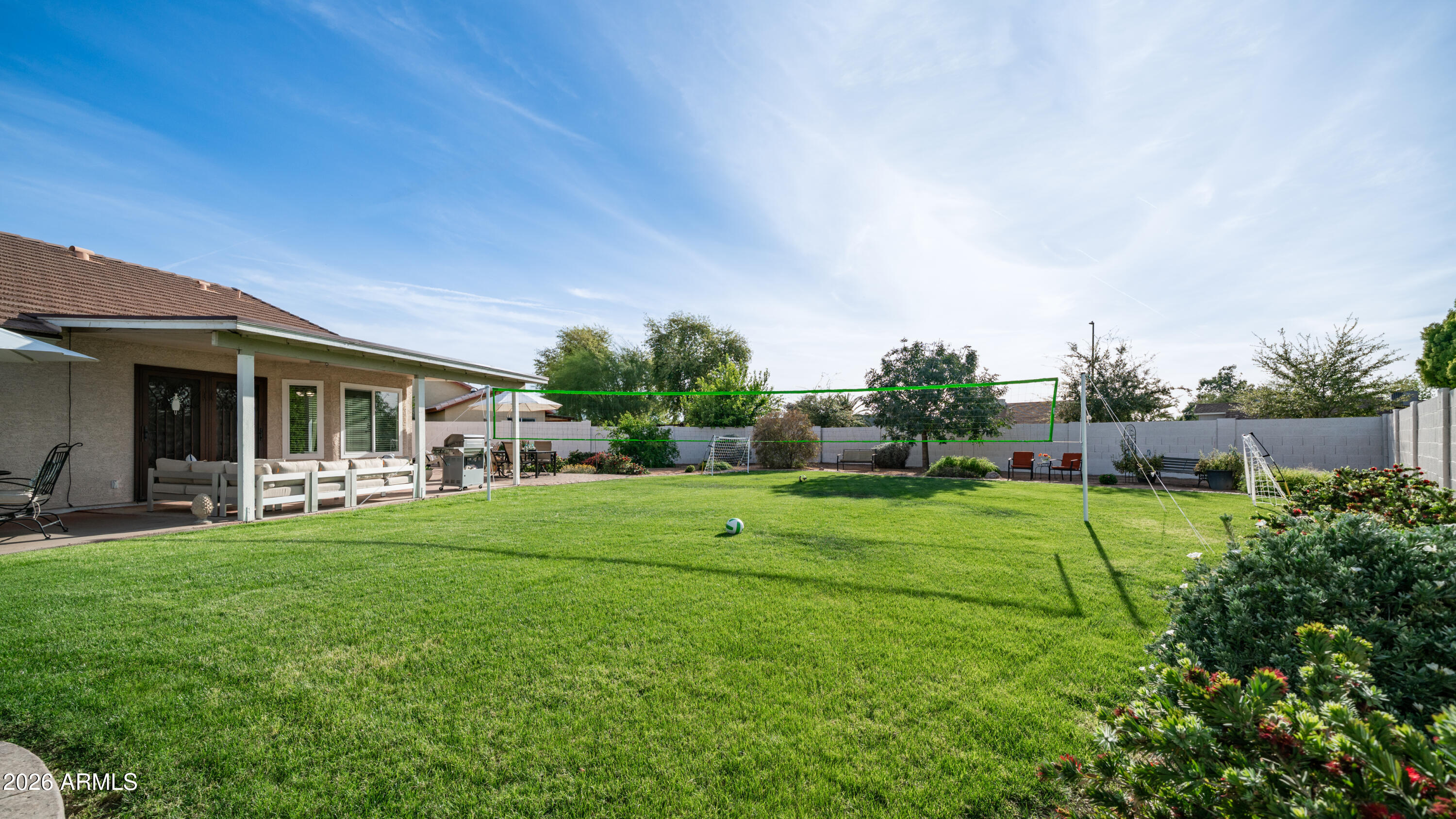 408 East Meadows Lane Gilbert, AZ 85234 - Photo 33 of 42 a view of a house with backyard and porch