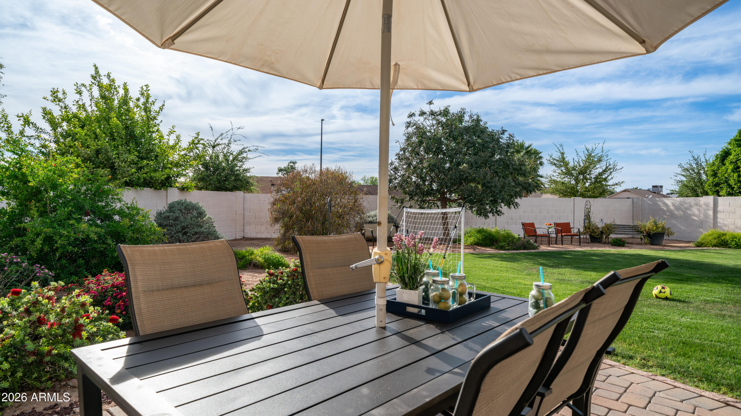 408 East Meadows Lane Gilbert, AZ 85234 - Photo 38 of 42 a view of a deck with furniture and a garden