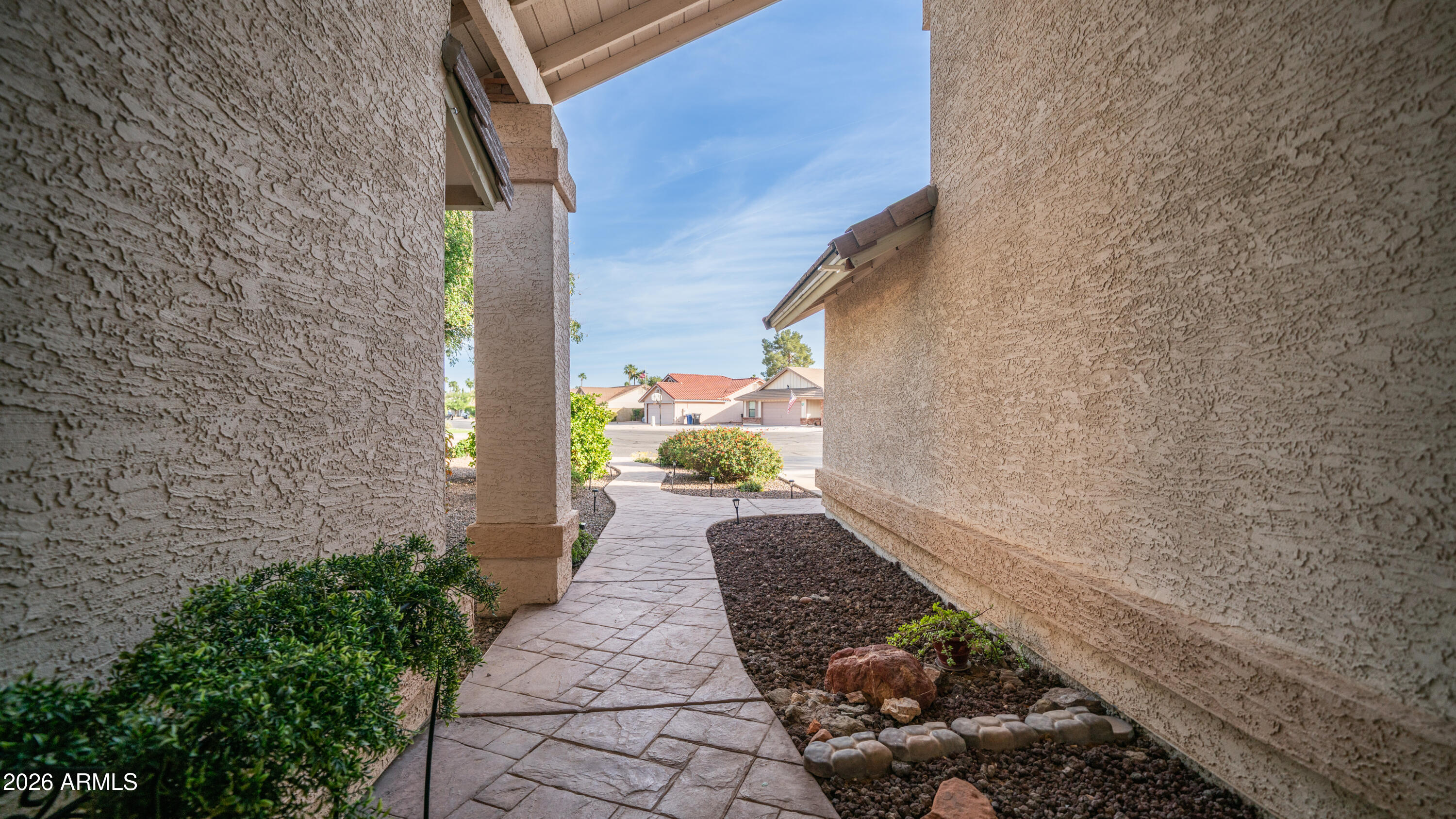 408 East Meadows Lane Gilbert, AZ 85234 - Photo 40 of 42 a view of a pathway that has potted plants