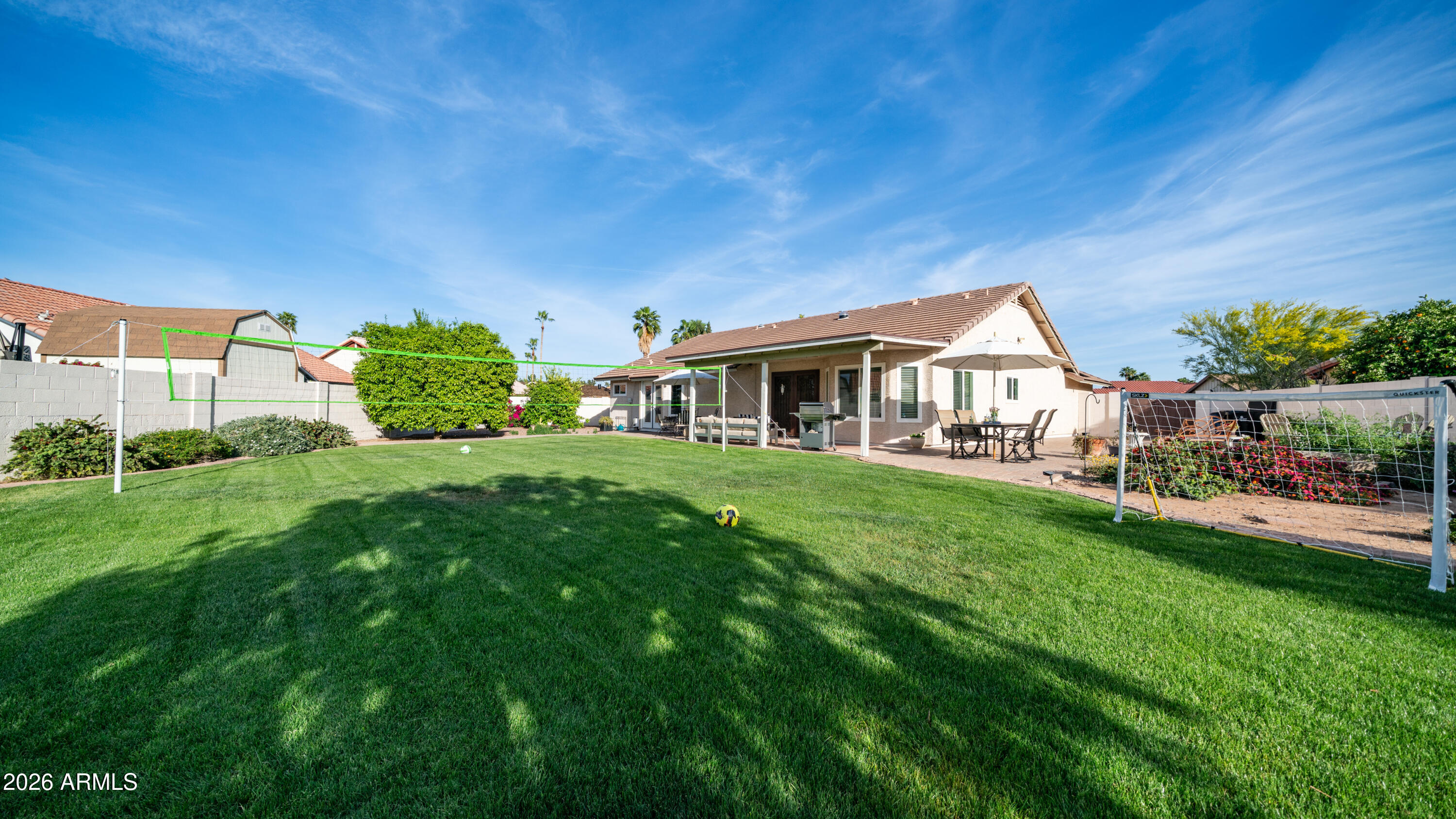 408 East Meadows Lane Gilbert, AZ 85234 - Photo 5 of 42 a front view of house with yard and green space