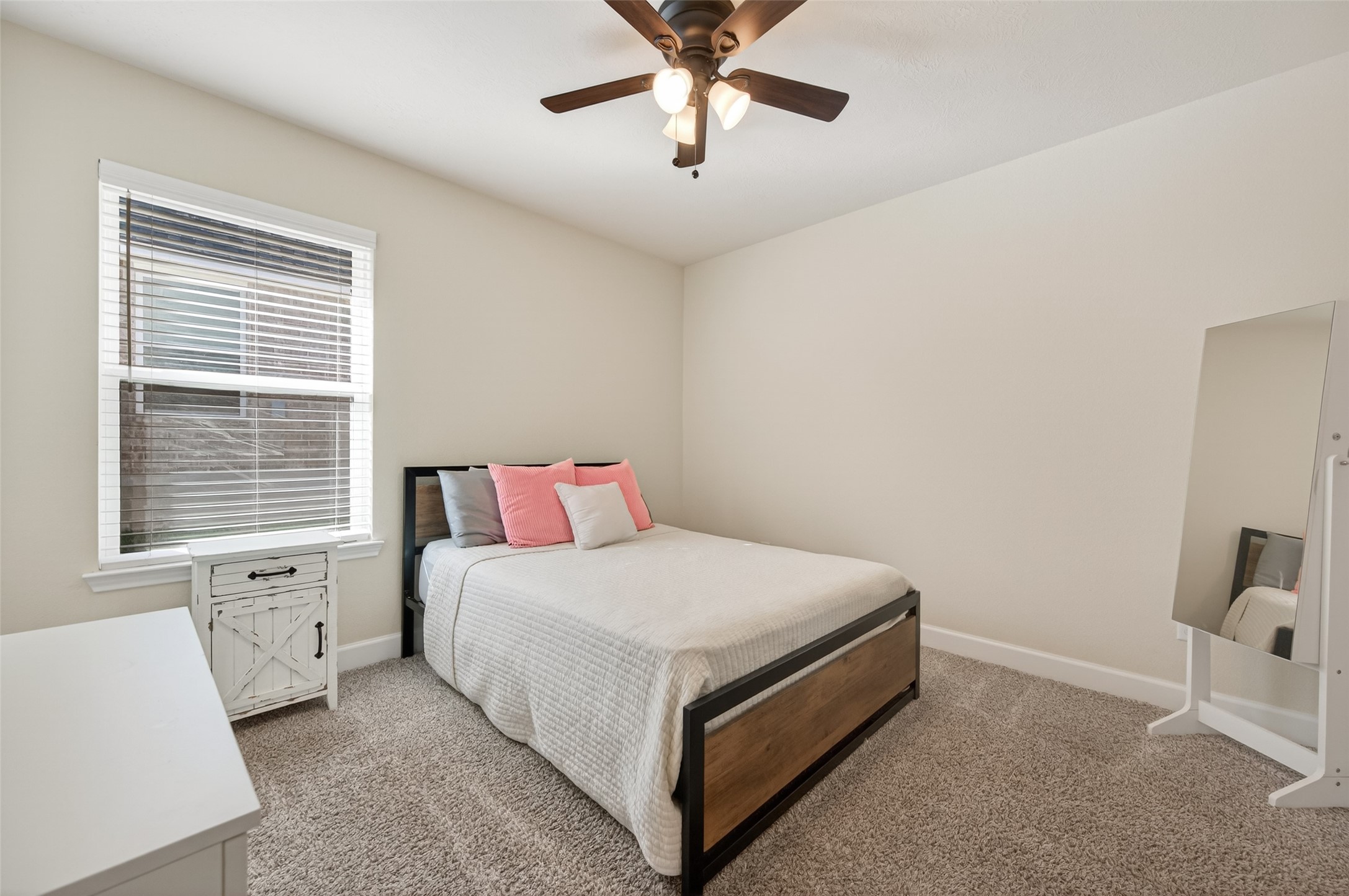 917 Farm Path Brenham, TX 77833 - Photo 35 of 43 a bedroom with a bed and a window