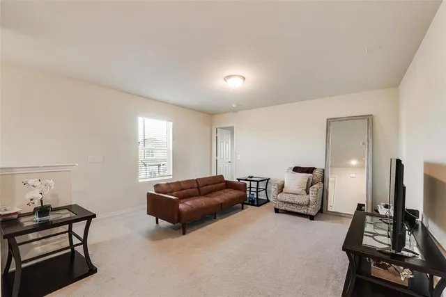 a bedroom with furniture and a window