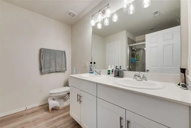 a bathroom with a shower and a sink