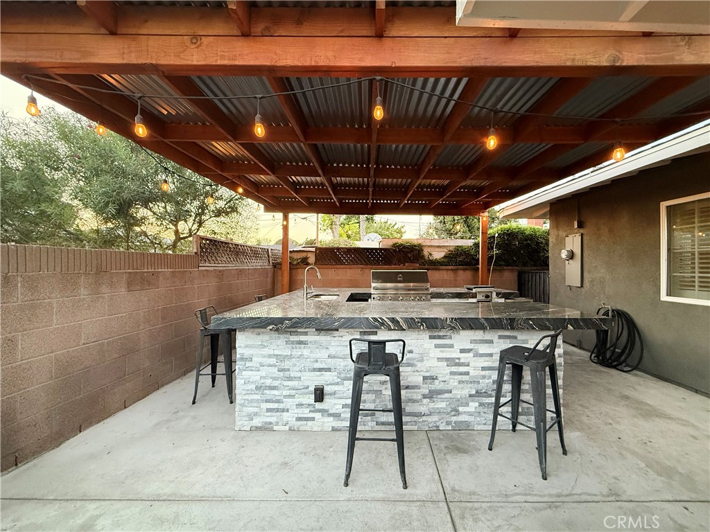 9305 Downey Avenue Downey, CA 90240 - Photo 38 of 45 BACKYARD WITH COVERED PATIO