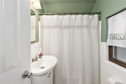 a bathroom with a sink and mirror