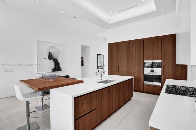 a kitchen with a stove a refrigerator and a refrigerator