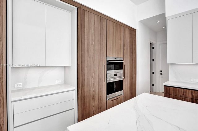 a bedroom with a bed and a cabinets