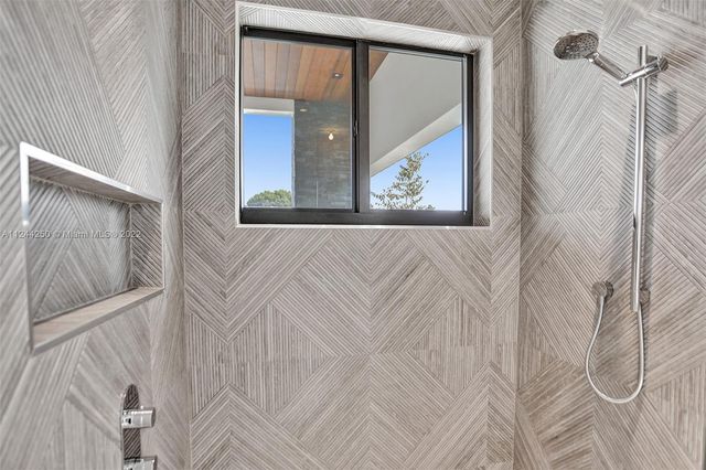 a view of a hallway with paintings on the wall