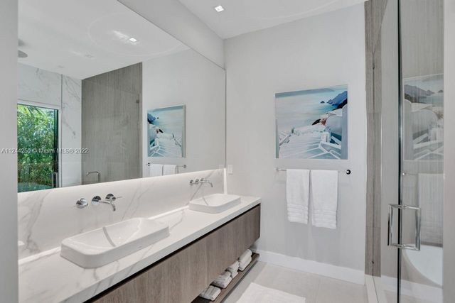 a bathroom with a bathtub and a sink