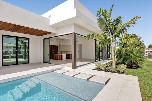 a potted plant sitting in front of a building
