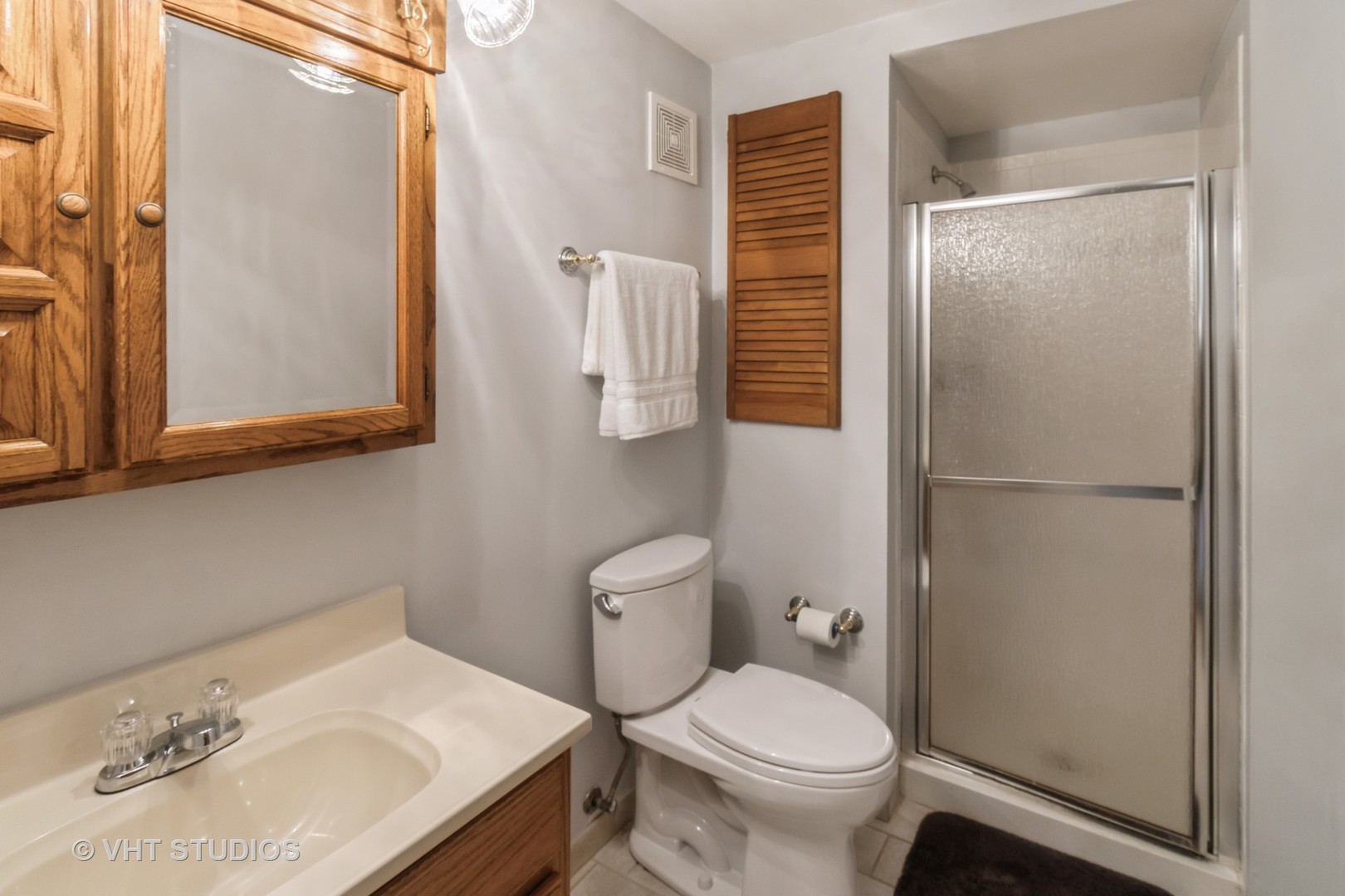 1942 Trail Ridge Street Arlington Heights, IL 60004 - Photo 15 of 29 a bathroom with a sink toilet and shower