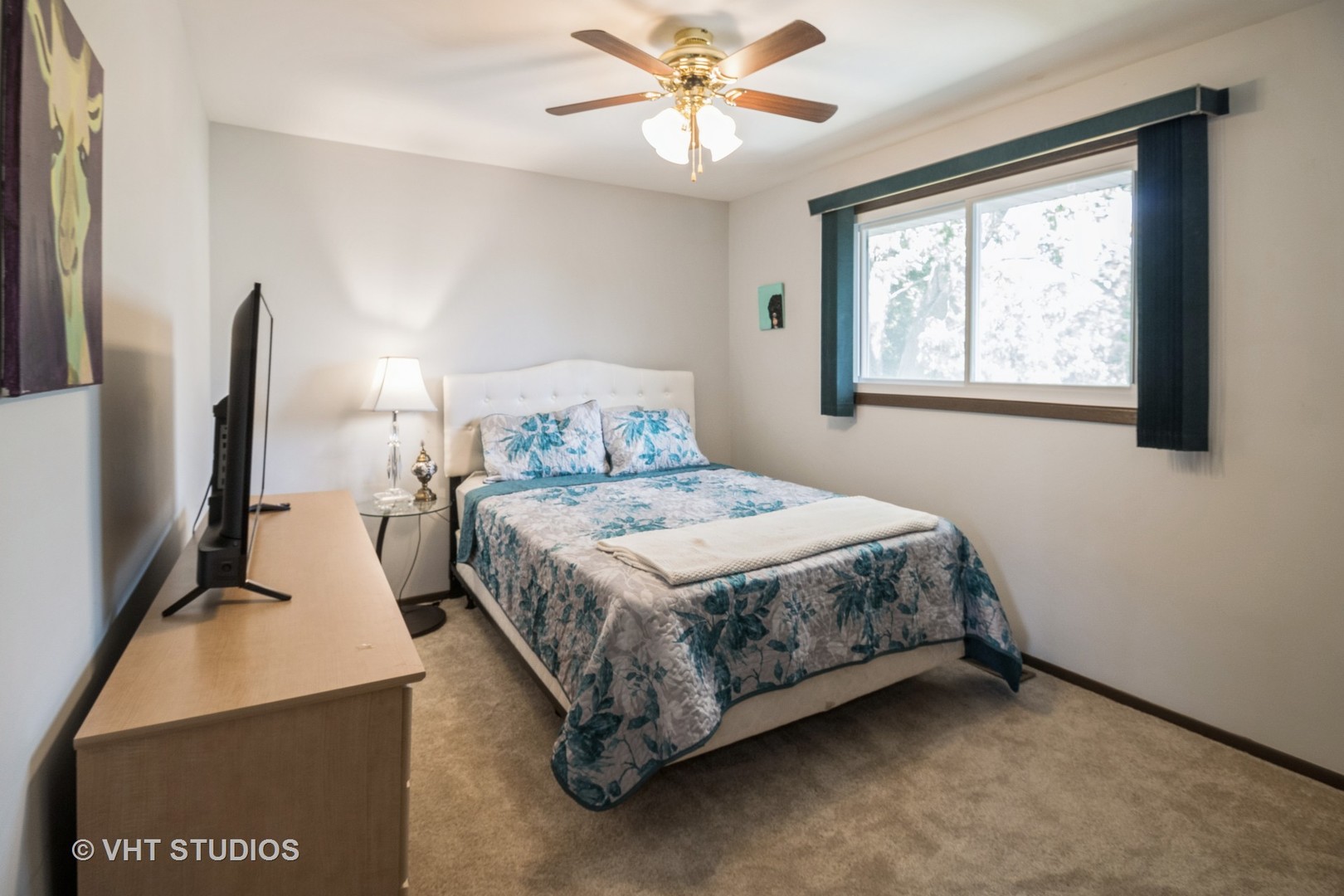 1942 Trail Ridge Street Arlington Heights, IL 60004 - Photo 16 of 29 a bedroom with a bed and a flat tv screen on the dresser