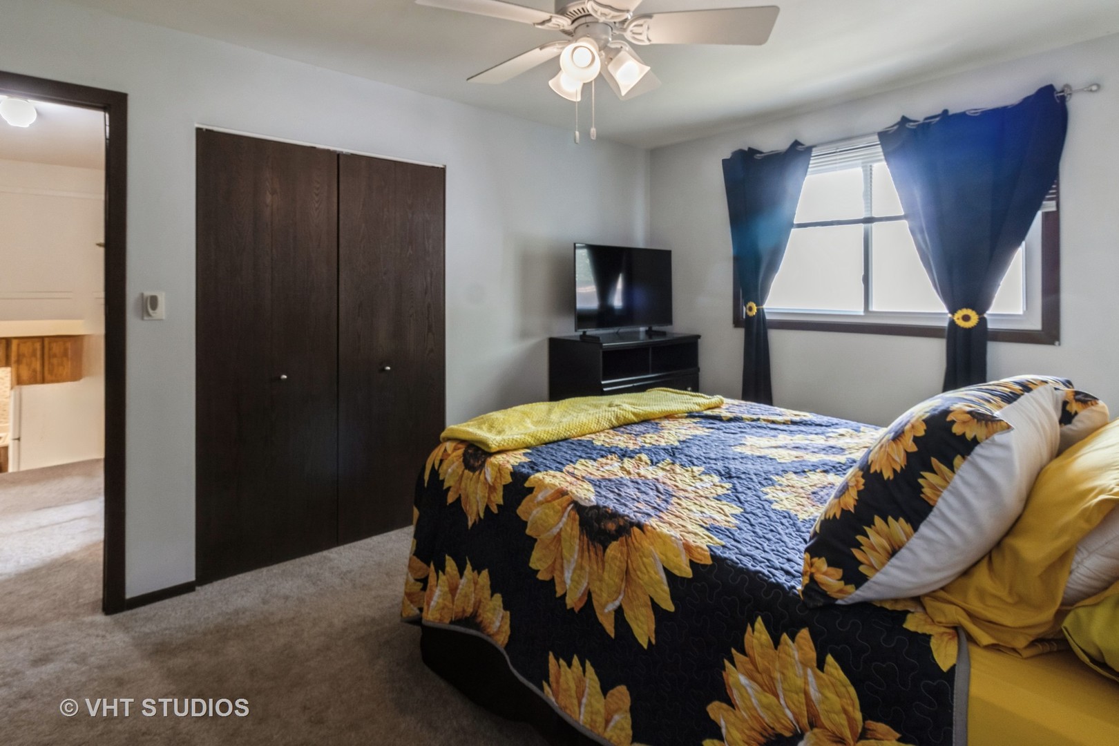 1942 Trail Ridge Street Arlington Heights, IL 60004 - Photo 18 of 29 a bedroom with a bed a window and a television
