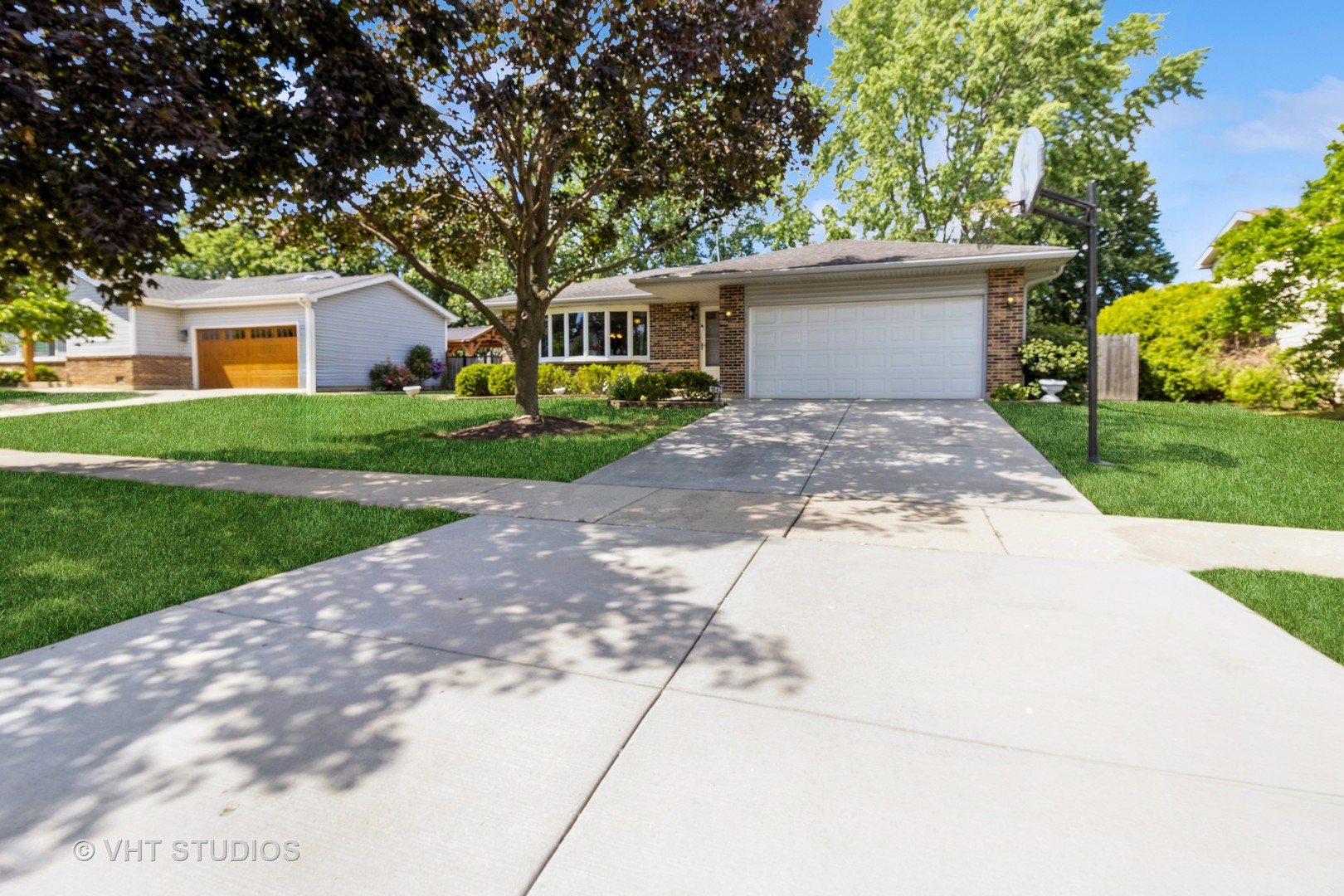 1942 Trail Ridge Street Arlington Heights, IL 60004 - Photo 25 of 29 a front view of a house with a yard and a garage