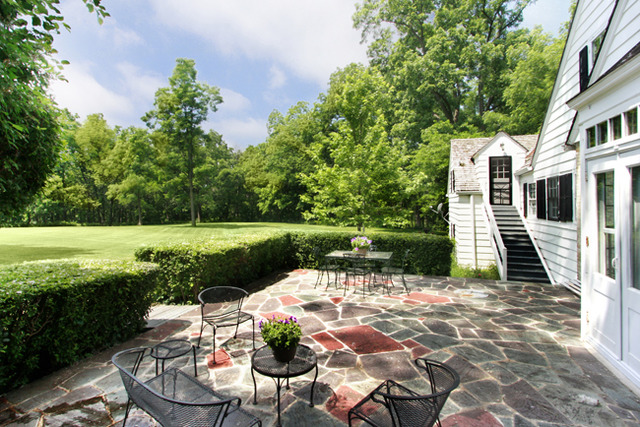 95 West County Line Road Barrington, IL 60010 - Photo 14 of 21 a view of a garden with chair and a table
