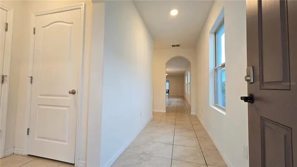 a view of a bathroom from a hallway