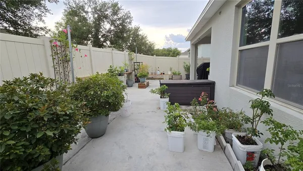 a view of a backyard with sitting area