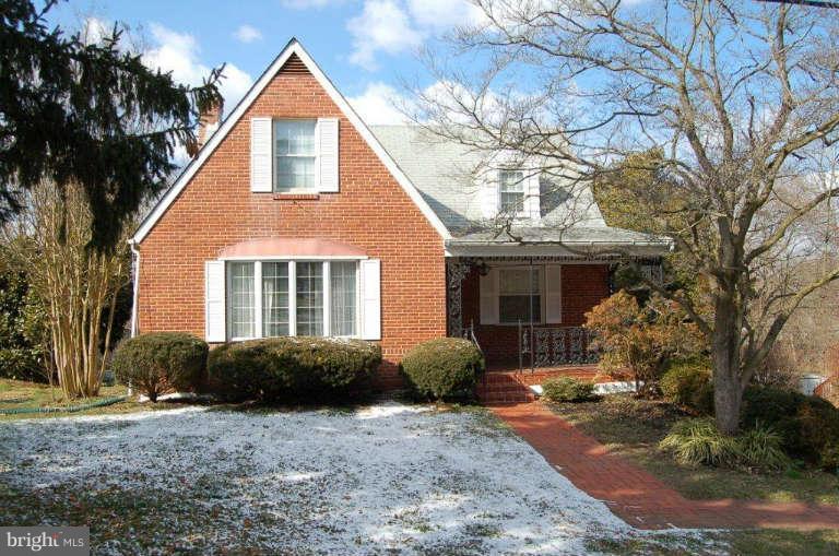 28 Cedar Knoll Road Cockeysville, MD 21030 - Photo 1 of 22 a front view of a house with a yard and garage