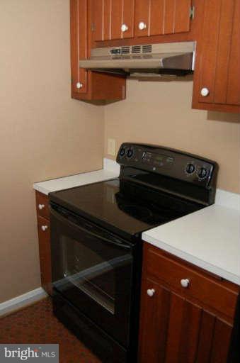 28 Cedar Knoll Road Cockeysville, MD 21030 - Photo 14 of 22 a close up of a stove top oven sitting inside of a kitchen