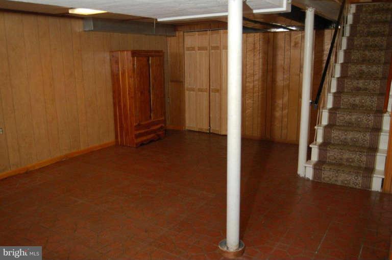 28 Cedar Knoll Road Cockeysville, MD 21030 - Photo 20 of 22 a view of an empty room with wooden floor and a window
