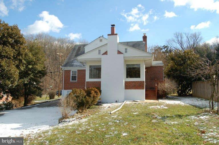 28 Cedar Knoll Road Cockeysville, MD 21030 - Photo 5 of 22 a view of a house with a yard and garage