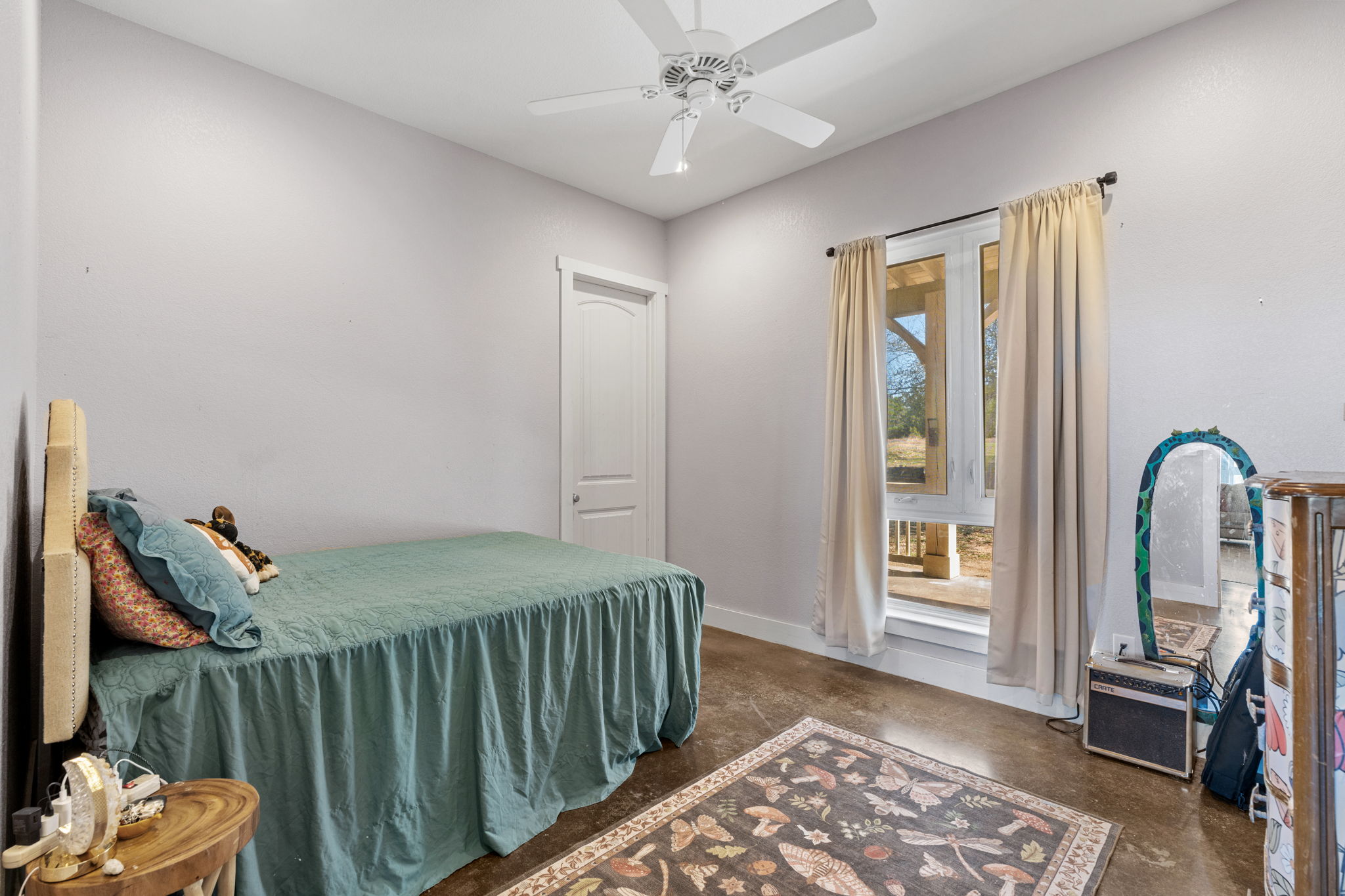 6350 Mt Sharp Road, Unit B Wimberley, TX 78676 - Photo 14 of 34 a bedroom with furniture and a window