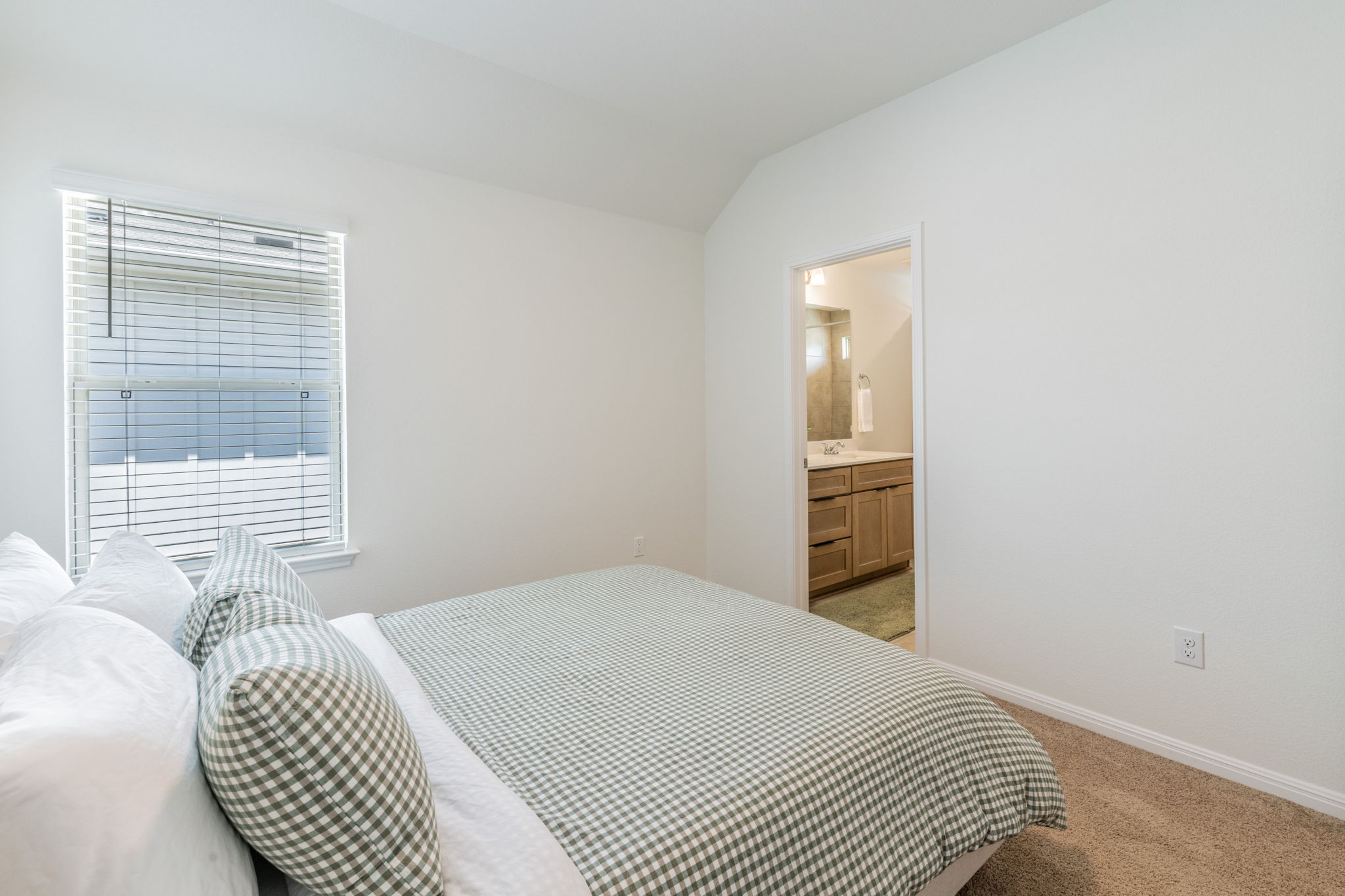 593 Backstays Loop Kyle, TX 78640 - Photo 13 of 26 a bedroom with a bed and a window