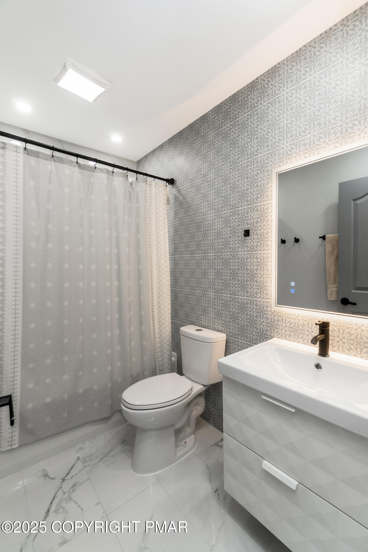 411 Alter Avenue Pocono Summit, PA 18346 - Photo 15 of 29 a bathroom with a sink a toilet a mirror and shower