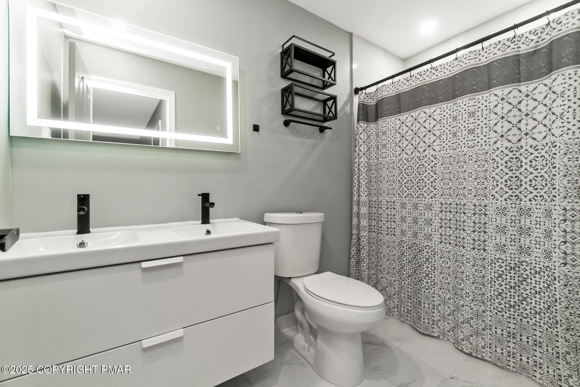 411 Alter Avenue Pocono Summit, PA 18346 - Photo 19 of 29 a bathroom with a sink a toilet and a mirror